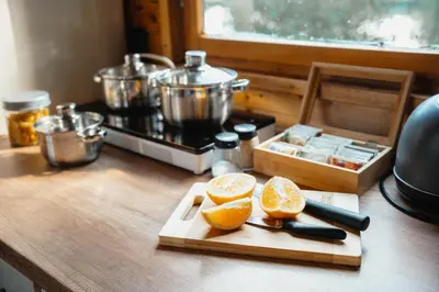 an orange cut in half on a cutting board at CozyTiny house at lake with sauna in Řehenice