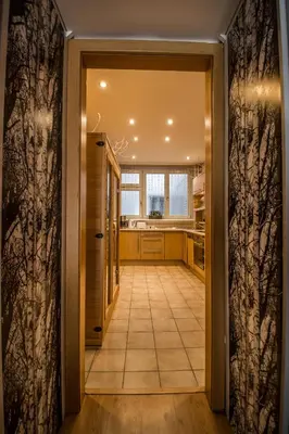 a hallway with a door leading into a kitchen at Main Prague Square apartments Sauna and Fireplace in Prague