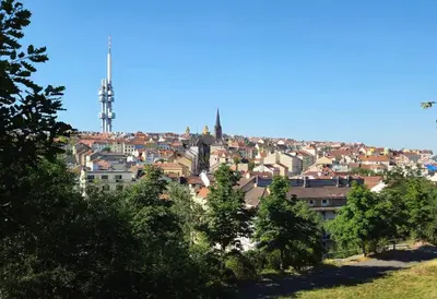 a view of a city from a hill with trees at Artistic Designer Studio Žižkov in Prague