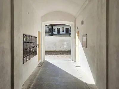 an empty hallway with an archway in a house at Artistic Designer Studio Žižkov in Prague