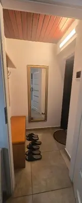 a room with a mirror and a pile of shoes at Vu's Home in Prague