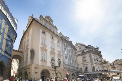 a group of people standing around a building at Apartments Old Town Square 27 in Prague