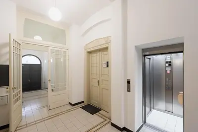 a bathroom with a toilet and a sink and a tub at Spacious apartments near the river Prague in Prague