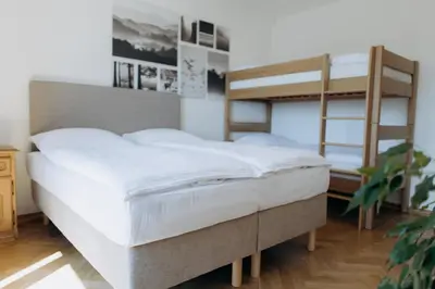 a bedroom with two bunk beds and a bed at FamilyVilla, new 4 Luxury Big Apartments, parking in Prague