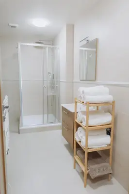 a bedroom with a large white bed and a couch at FamilyVilla, new 4 Luxury Big Apartments, parking in Prague