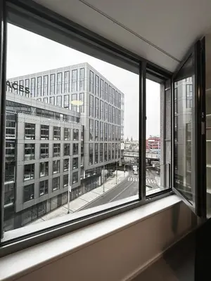 an office window with a view of a building at Mozart Apartments Prague in Prague