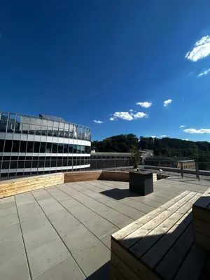 a view of a building with a bench in front of it at Mozart Apartments Prague in Prague