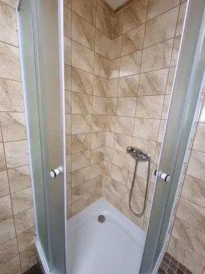 a bathroom with a shower with a toilet at Studio Carolina in Mratín