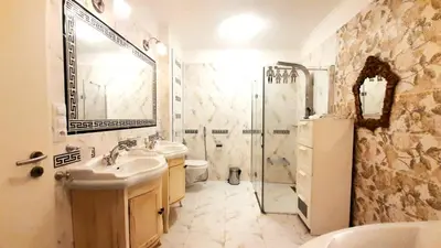 a bathroom with a sink toilet and a shower at Spacious Suite - KindStay Suites Prague Airport in Kněžívka