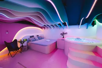 a room with a bed and a bath tub at SPA SPA Legerova in Prague