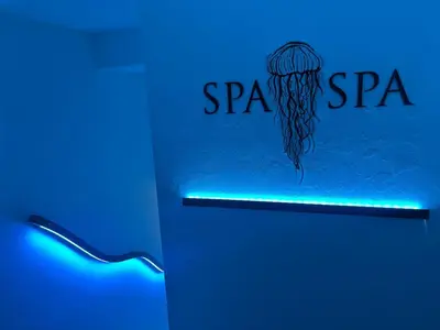 a neon sign with a basketball hoop on a wall at SPA SPA Legerova in Prague