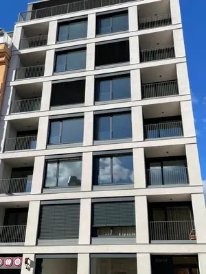 a tall building with windows on the side of it at O2 Arena - Alex Apartment Praha in Prague