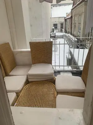 two chairs and a couch on a balcony at TDC31, boo in Prague
