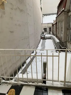 a balcony covered in snow with a railing at TDC31, boo in Prague