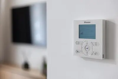 a white object on a wall with a television at R16 Residences Prague in Prague