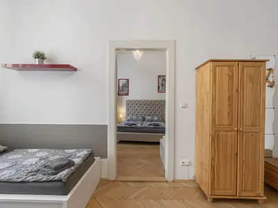 a bedroom with a bed and a wooden cabinet at Apartment Old Town home-1 by Interhome in Prague
