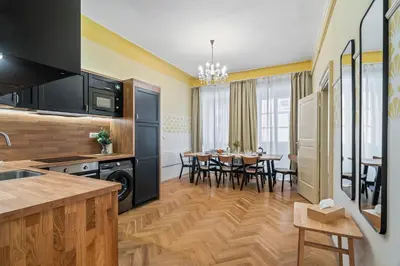 a kitchen and dining room with a dining table at Charles Bridge Historical APTs by Michal&Friends in Prague