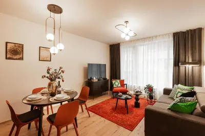 a living room with a couch and a table at Chill in Oriental Splendour in Prague