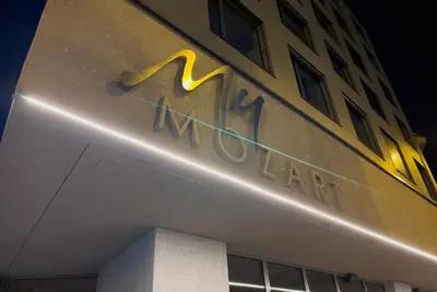 a hotel sign on the side of a building at Residence My Mozart in Prague