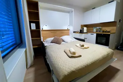 a bedroom with a bed with towels on it at Residence My Mozart in Prague