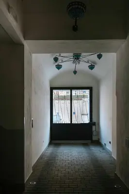 an empty room with a window in a building at 150m² 4BR Duplex Near Metro & Prague Center in Prague