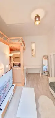 a living room with a bunk bed and a couch at Cozy Karlín Loft City Center in Prague