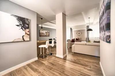 a living room with a couch and a table at Exclusive 2 bedroom apartment Old Town - 2 baths, balcony and view - by Prague City Apartments in Prague