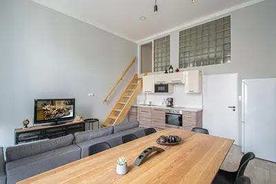a living room with a couch and a table at Sightseeing apartment by Ruterra in Prague