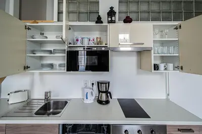 a kitchen with a sink and a counter top at Sightseeing apartment by Ruterra in Prague