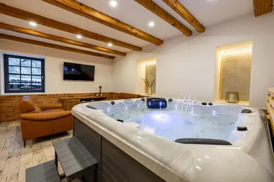 a large bathroom with a large tub in a room at Relax apartmán na Mlejnici in Nové Strašecí