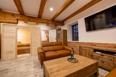a living room with a couch and a table at Relax apartmán na Mlejnici in Nové Strašecí