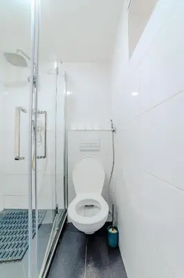 a bathroom with a toilet and a glass shower at Hostel Comfort in Prague