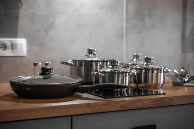 a pan sitting on top of a stove in a kitchen at Majestic Square View Residence in Prague