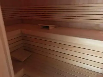 a walk in closet with wooden floors and shelves at Luxury villa near Prague with pool and tennis court in Čestlice