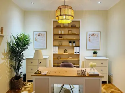 an office with a desk and a book shelf at Home away from home in Prague