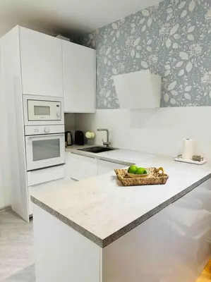 a kitchen with a bowl of fruit on a counter at Home away from home in Prague