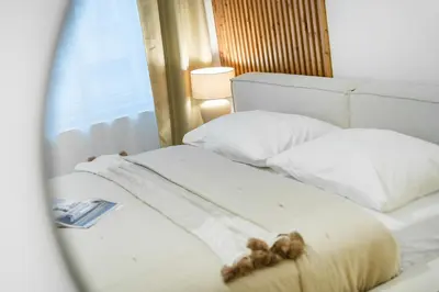 a close up of two beds in a room at Rentero Cozy Wenceslas square 700m Apartment, Prague in Prague