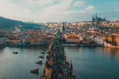 a view of a city with a river and buildings at Rentero Cozy Wenceslas square 700m Apartment, Prague in Prague