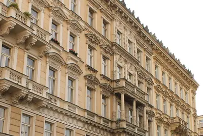 a large building with balconies on the side of it at Royal Prague Apartment Celakovskeho Sady in Prague