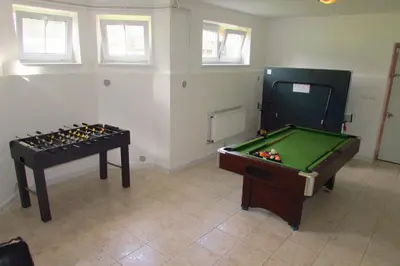 a room with a pool table and a snooker table at Wellness Villa Vranov 55 in Čerčany