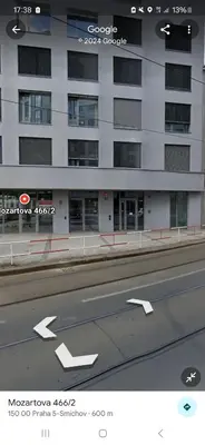 a large building with arrows on the side of a road at Prague City Center Apartment in Prague