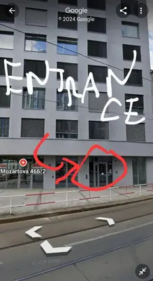 a building with a red circle on the side of it at Prague City Center Apartment in Prague