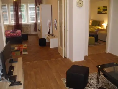 a view of a living room with a couch and a table at Apartments Tronicek in Prague