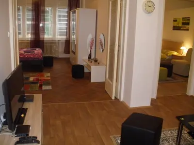 a view of a living room with a kitchen and a living room at Apartments Tronicek in Prague