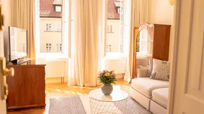 a living room with a couch and a table at Residence Dvorak in Prague