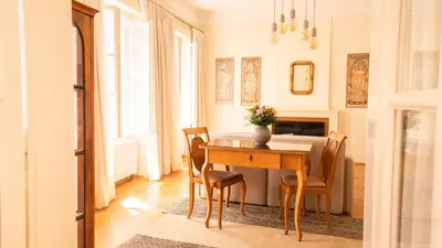 a dining room with a table and chairs at Residence Dvorak in Prague
