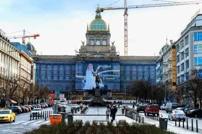a large building with a picture of a woman on it at NEW DESIGN & STYLE Apartments 50m from Wenceslas Square in Prague