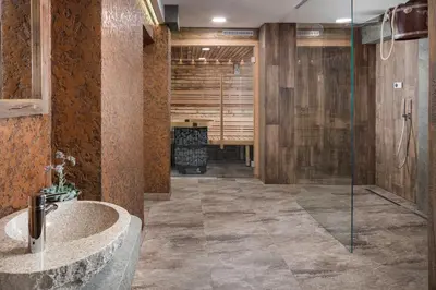 a bathroom with a glass shower and a sink at Dvůr Pecínov in Benešov