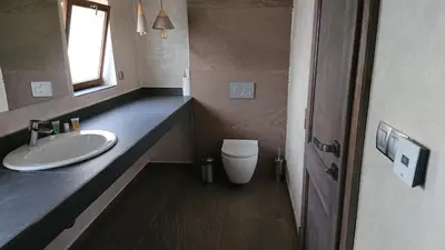 a bathroom with a sink and a toilet at Dvůr Pecínov in Benešov
