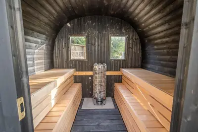 an inside view of a sauna with wooden walls at Kokořín Apartments in Kokořín